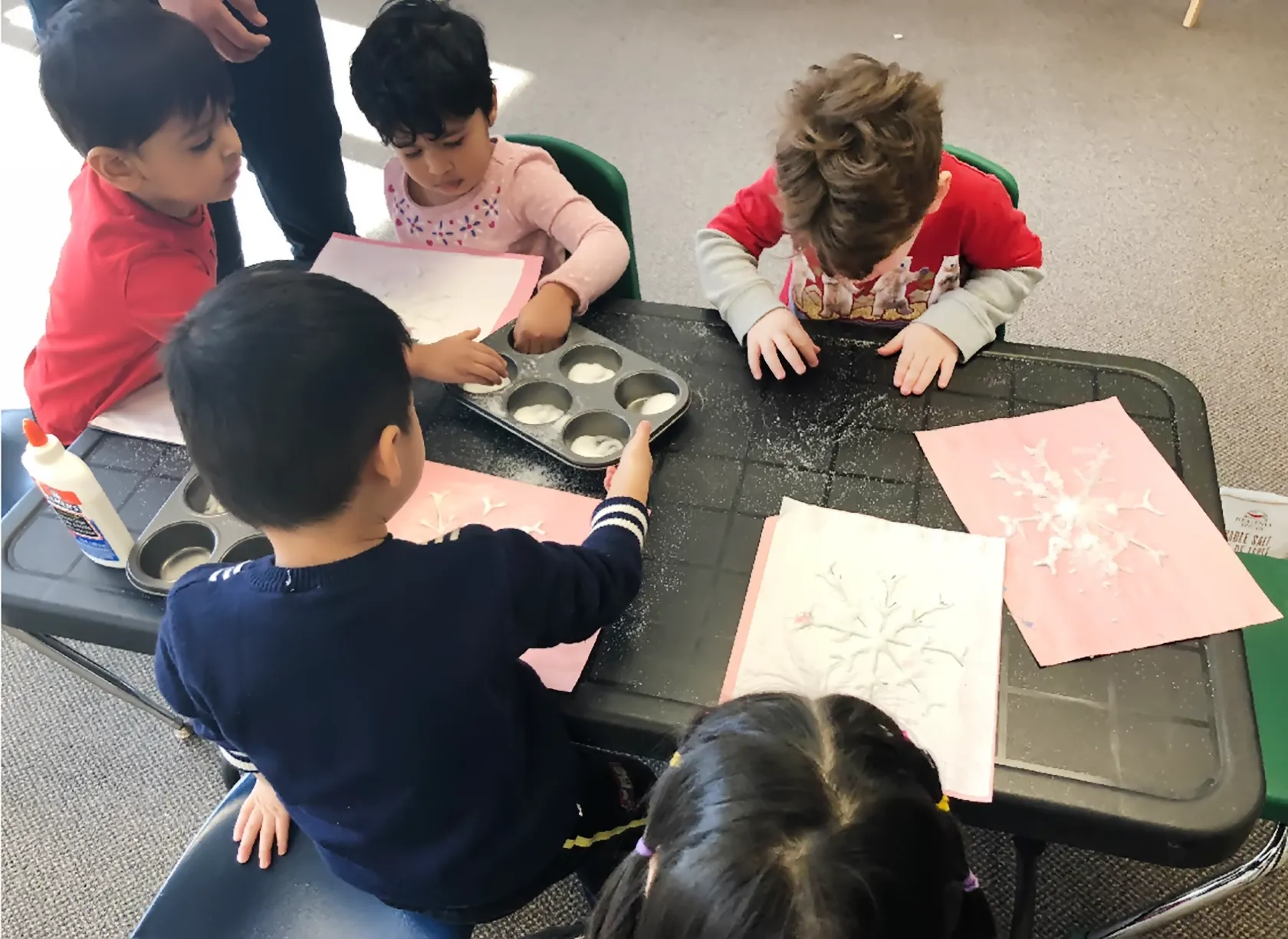 Children exploring a creative Montessori activity