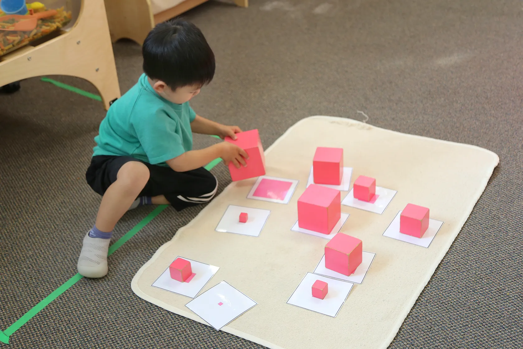 Montessori sensorial materials arranged in a classroom