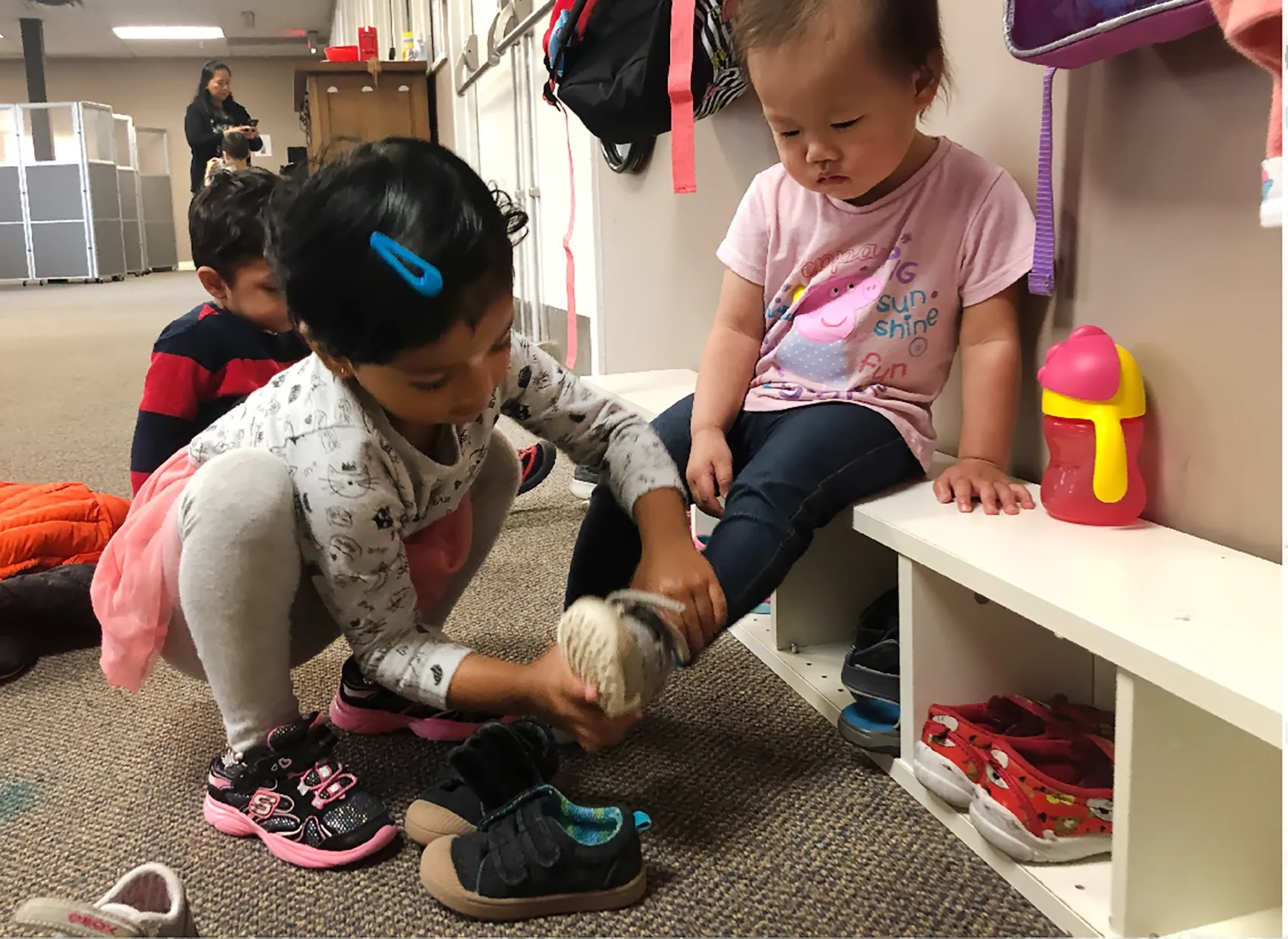 Child working with Montessori practical life materials